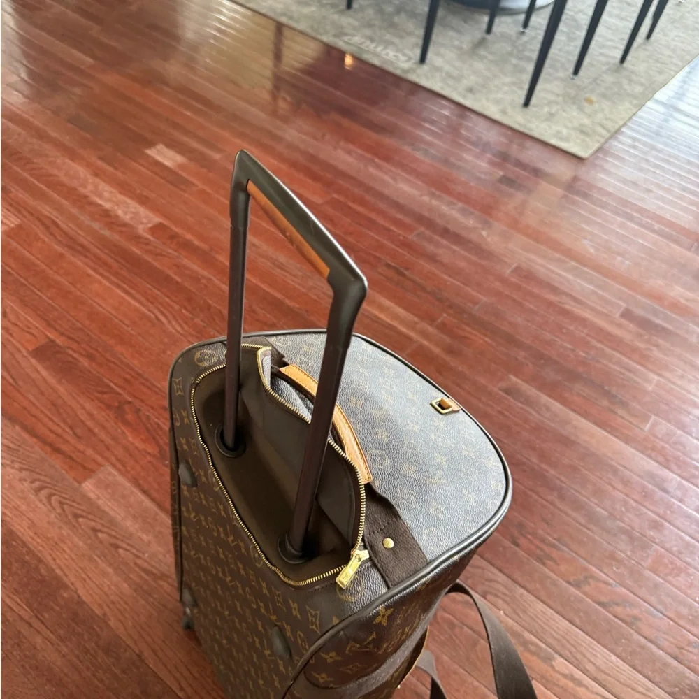 Louis Vuitton Monogram Canvas Rolling Duffel in Brown and Tan